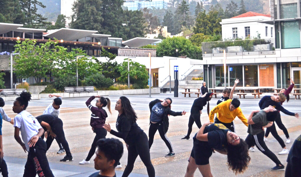 Photo of students putting on an outdoor dance performance on the UC Berkeley campus