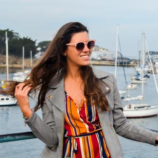 Yasmin standing near a marina in Carmel