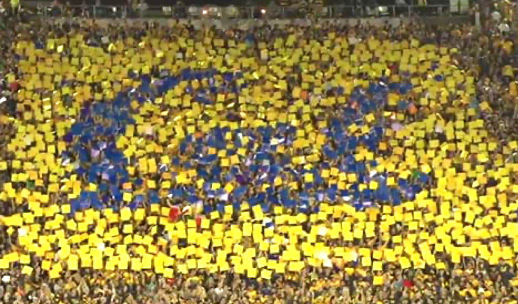 Photo of a UC Berkeley card stunt at a Cal football game, together spelling "Cal"