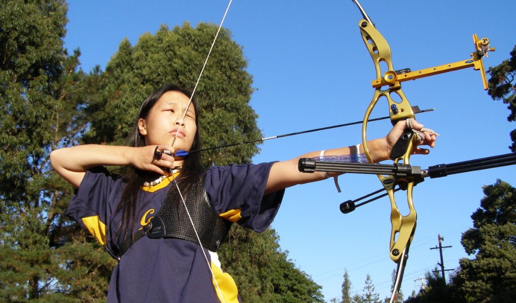 Photo of a Berkeley student doing archery