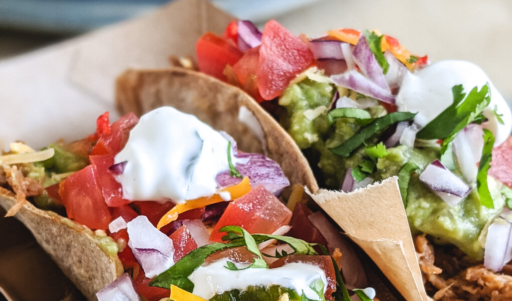 Tacos loaded with veggies, sour cream and guac